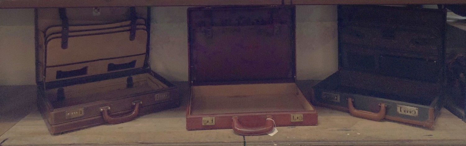 Three leather briefcases