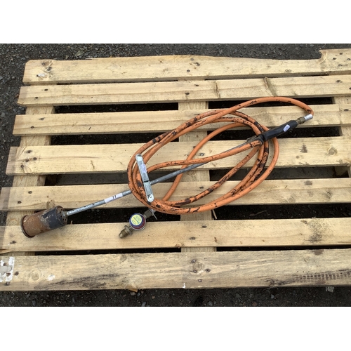 77 - A blow torch and hose