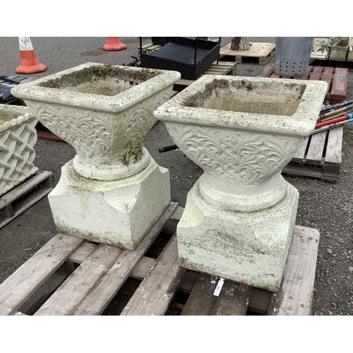 87 - A pair of substantial reconstituted stone planters