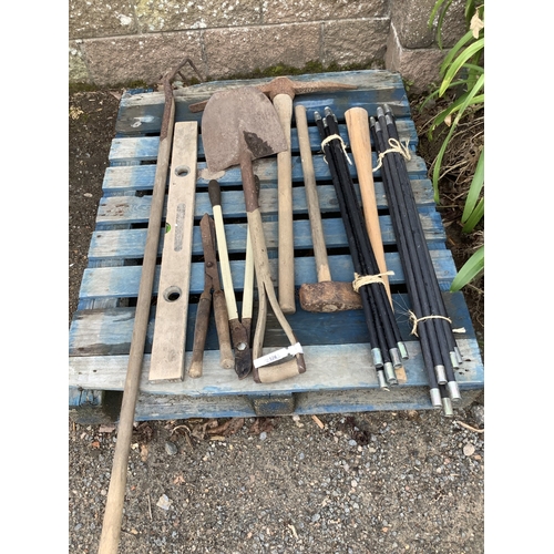 126 - A quantity of drain rods together with an assortment of hand tools