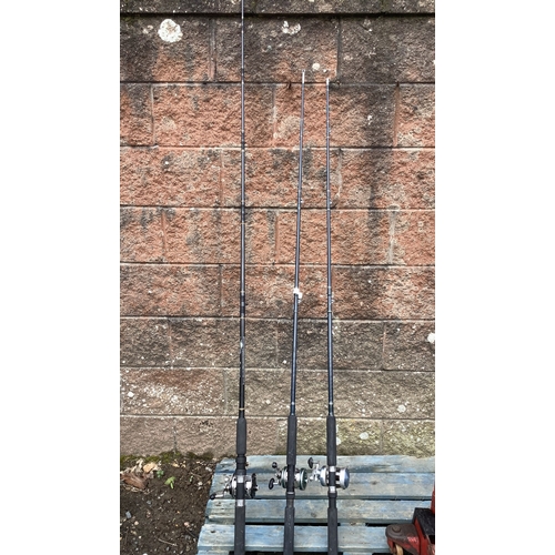 128 - Three boat fishing rods each fitted a multiplier fishing reel