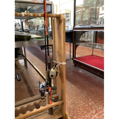 351 - A Jarvis Walker Aurora plugging rod fitted a new rear drag fixed spool reel together with a Kanji pl... 