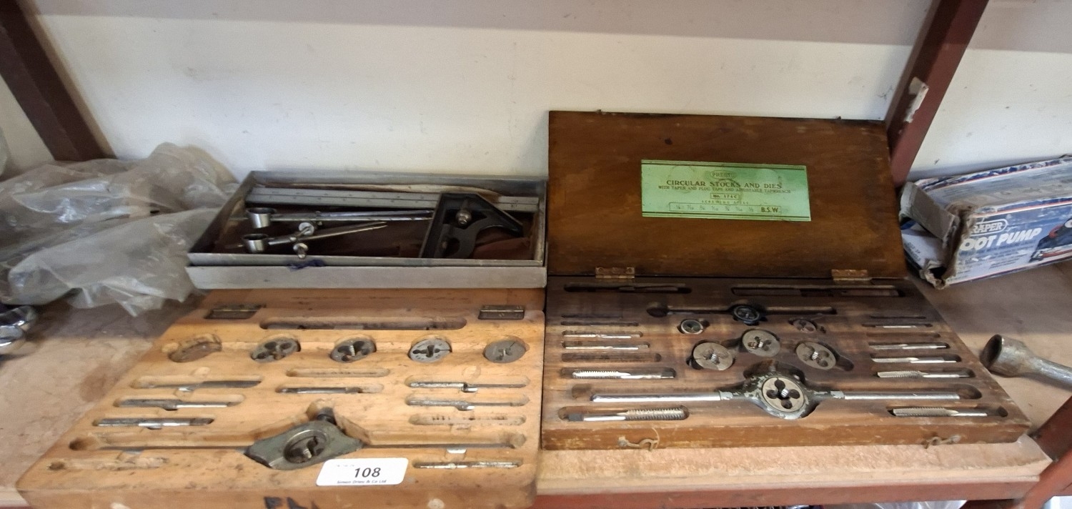 Two tap and die sets together with an adjustable set square and two ...