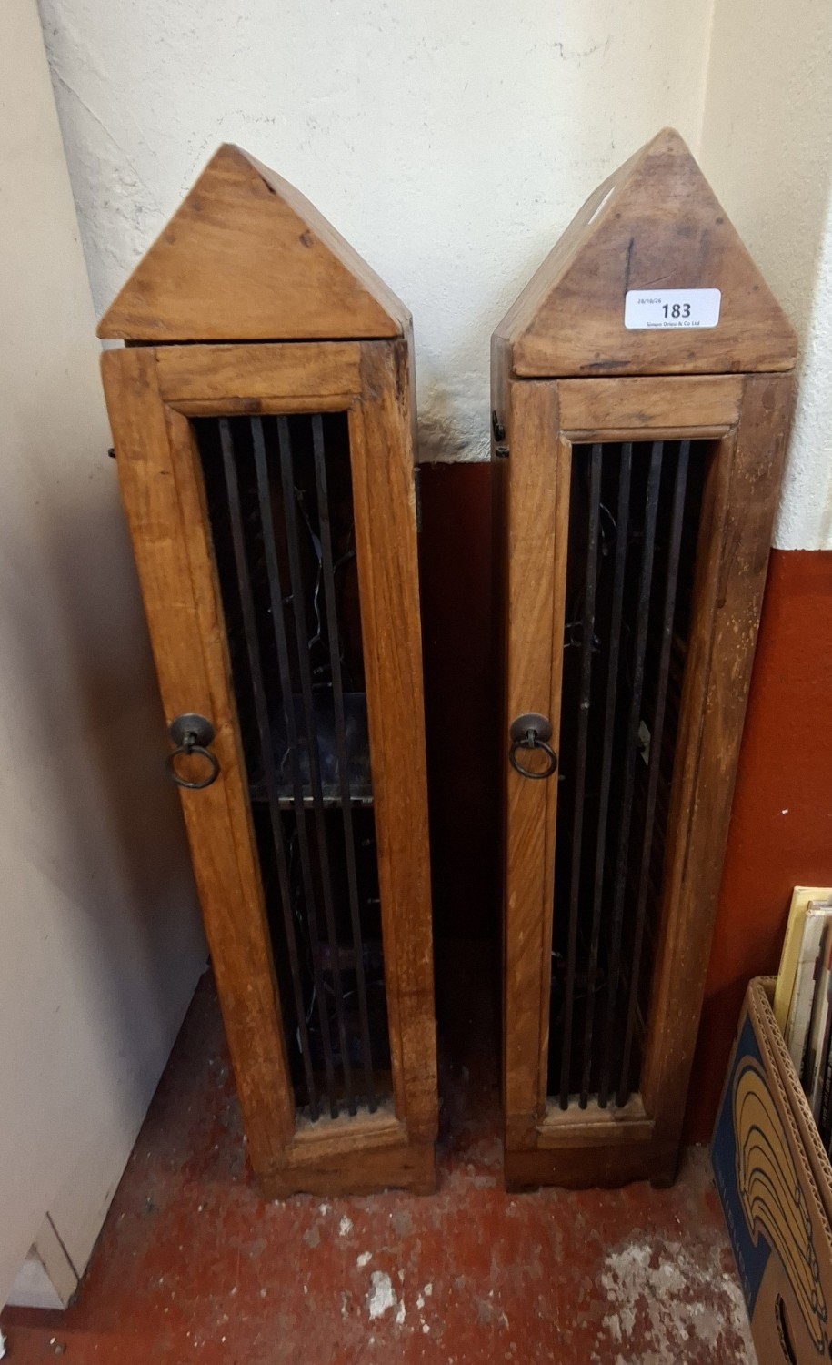 A pair of Indonesian rosewood compact disc cabinets of triangulated form