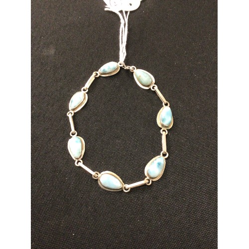 64 - Silver blue hardstone cabouchon set bracelet