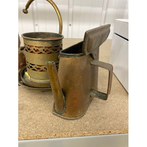 23 - Collection of copper and brass items including watering cans and crumb tray