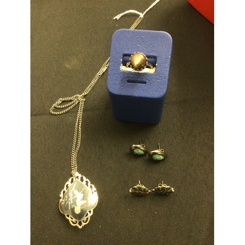 60 - Silver necklace/brooch, 2 pairs of silver earrings and a silver moonstone ring