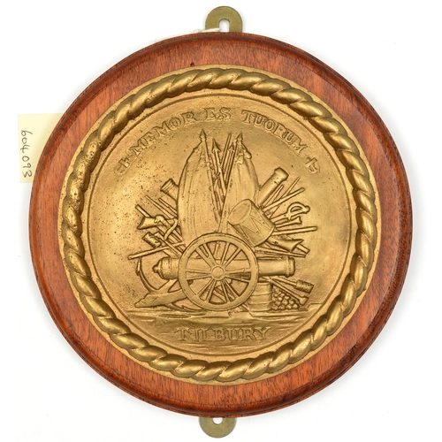 556 - A cast brass circular badge of HMS Tilbury, destroyer 1918-31, showing a cannon on trophy of flags, ... 