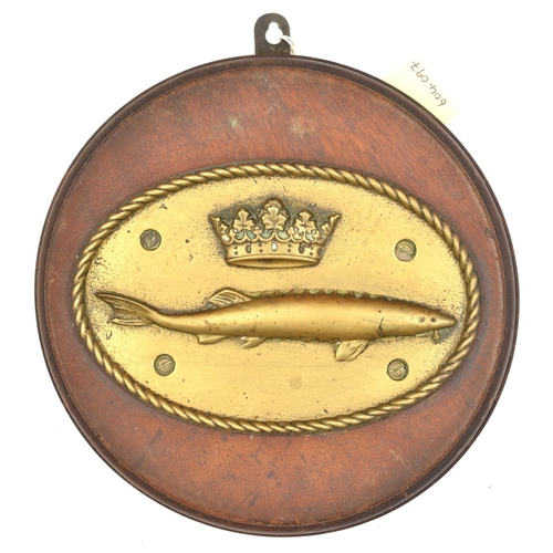 559 - A cast brass oval badge of HMS Sturgeon, destroyer 1917-26, showing a sturgeon with coronet above, i... 