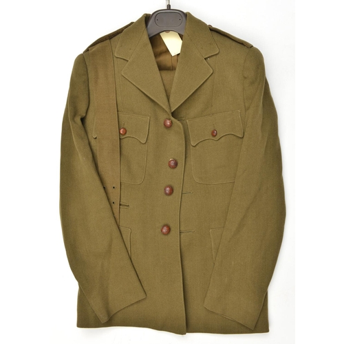 634 - A scarce WWII Women's Land Army private purchase khaki full dress uniform, 4 pocket jacket, with wai... 