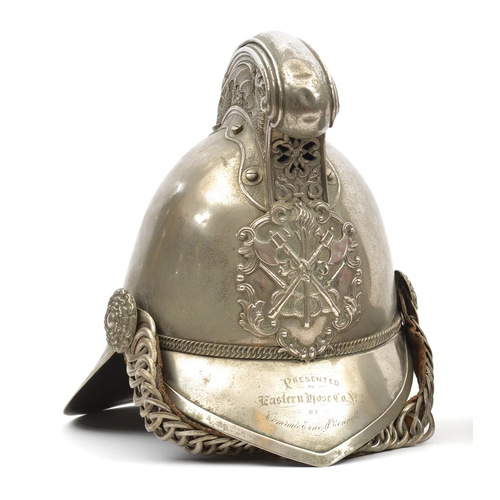 643 - A fire officer's presentation WM Merryweather pattern helmet,  with front peak and large back peak, ... 