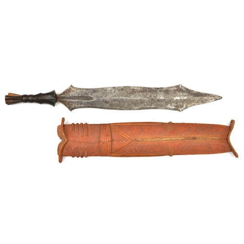 195 - An African Salampasu head hunter’s tribal knife. Early 20th century, broad DE blade 42.5cms, carved ... 