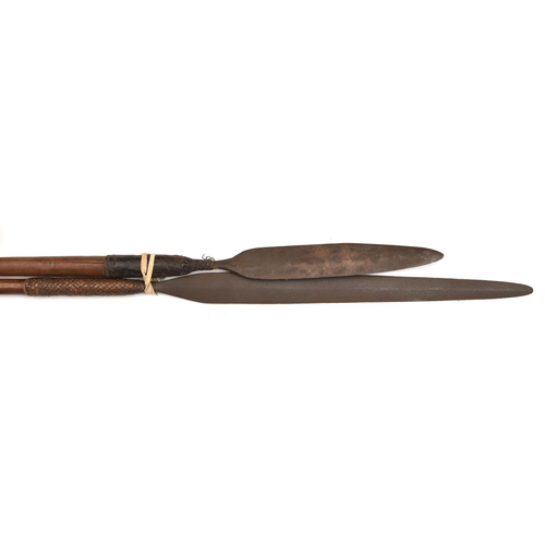 538 - A Zulu stabbing spear, leaf shaped blade 11”, darkwood haft, 39” overall, and another, slender leaf ... 