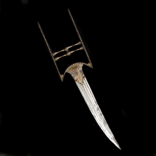 136 - An Indian dagger katar. Mid-18th century, later slightly curved wootz blade 21cms, with raised rib, ... 