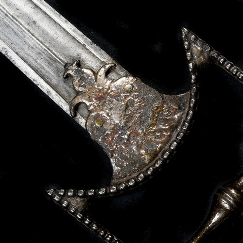 136 - An Indian dagger katar. Mid-18th century, later slightly curved wootz blade 21cms, with raised rib, ... 