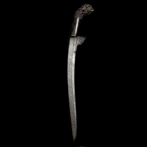 144 - A scarce Sumatran dagger sekin. 19th century, curved SE blade 29cms with scrolled top, horn hilt wit... 