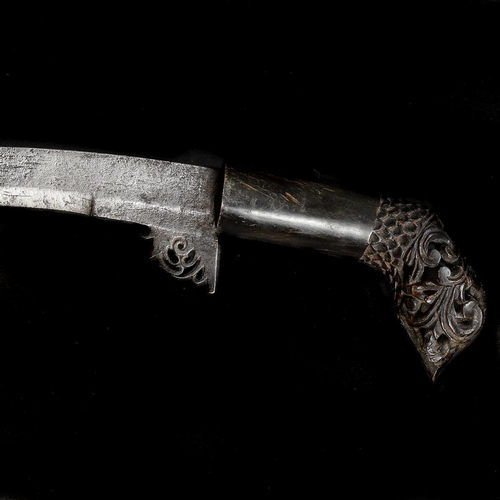 144 - A scarce Sumatran dagger sekin. 19th century, curved SE blade 29cms with scrolled top, horn hilt wit... 