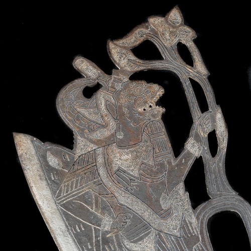 152 - A Balinese ceremonial axe. 20th century, broad iron head pierced and silver damascened with a wayang... 