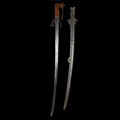 154 - A Moroccan sword nimcha. Second half of the 19th century, slightly curved SE blade 94.5cms cut with ... 