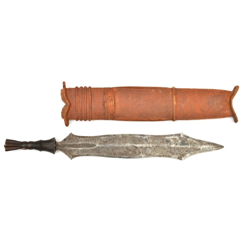 195 - An African Salampasu head hunter’s tribal knife. Early 20th century, broad DE blade 42.5cms, carved ... 