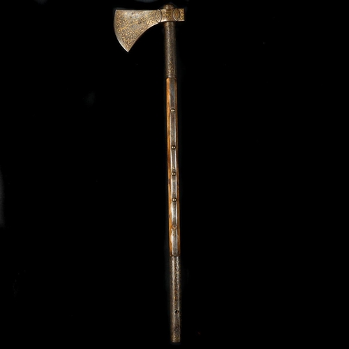 209 - An Ottoman Turkish axe. 19th century, iron head with 8.5cms crescent edge, covered with gold damasce... 