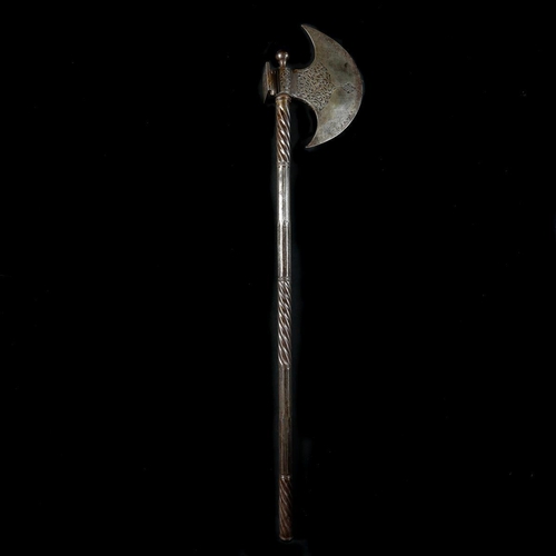 210 - A Persian Qjar dynasty all iron axe. Crescent shaped head 19.5cms, chiselled with inscriptions and o... 