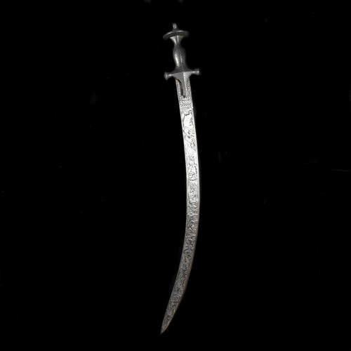 218 - An Indian hunting sword tulwar shikargar. Late 19th century, curved SE blade 69cms chiselled overall... 