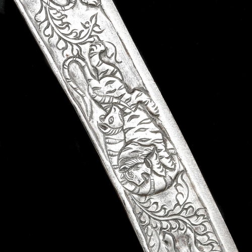 218 - An Indian hunting sword tulwar shikargar. Late 19th century, curved SE blade 69cms chiselled overall... 