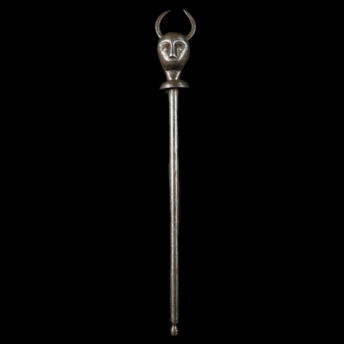 228 - A Persian all iron mace. 73cms, head embossed as a devil’s head with applied horns and bicycle bell-... 