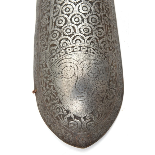 234 - A Persian iron arm guard bazu band. Qjar dynasty, 30cms chiselled with a fish covered with scales co... 