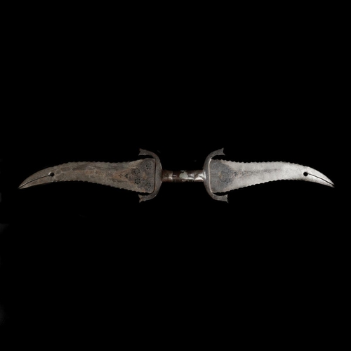 237 - An Indian double-dagger haladie. Late 19th century twin opposed broad wavy-edge blades 27cms with bi... 