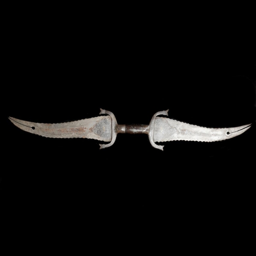 237 - An Indian double-dagger haladie. Late 19th century twin opposed broad wavy-edge blades 27cms with bi... 