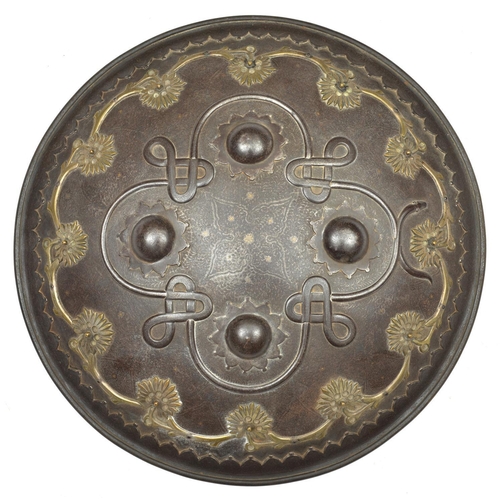 242 - An Indian iron shield dhal. Late 19th century, probably Sialkot, 35.5cms fitted with 4 iron bosses, ... 