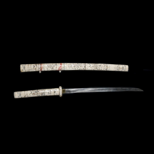 254 - A decorative Japanese carved bone sword. First half of the 20th century, blade 39.5cms (not forged o... 