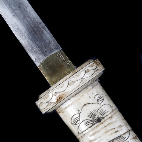 254 - A decorative Japanese carved bone sword. First half of the 20th century, blade 39.5cms (not forged o... 