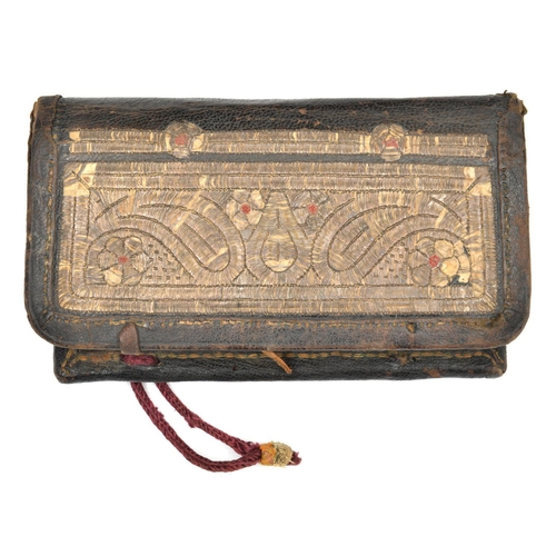 264 - An Ottoman embroidered leather cartouche barutluk. 19th century, 16.5cms, front flap covered with si... 