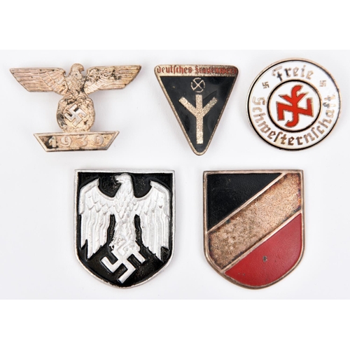 382 - A Third Reich bar to the 1914 Ist Class Iron Cross; 2 metal shield badges for the tropical helmet; a... 