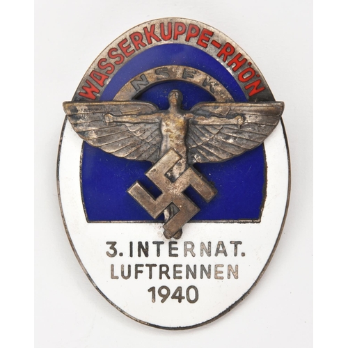 390 - A Third Reich pin back oval enamelled badge, superimposed in the centre is the NSFK symbol, on a blu... 