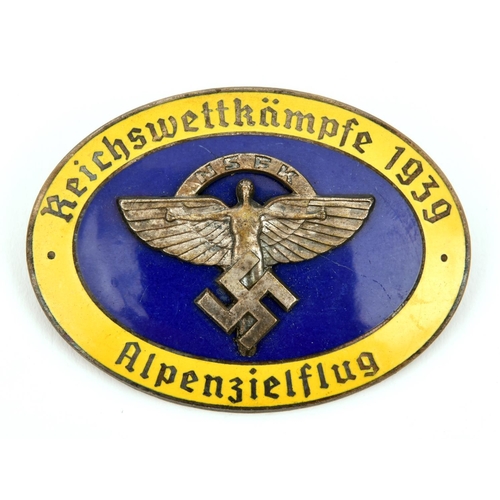 391 - A Third Reich pin back oval enamelled badge, superimposed in the centre is the NSFK symbol on blue g... 