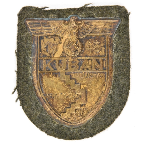 401 - A Third Reich Kuban shield,  on field grey cloth patch with zinc backing plate. GC                  ... 