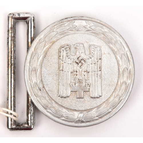 403 - A Third Reich 1938 pattern Red Cross Leader’s aluminium belt buckle,  the back stamped “Ges. Gesch” ... 