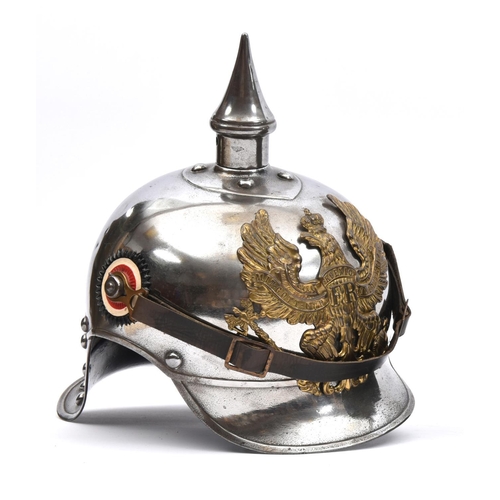 415 - A WWI Prussian Cuirassier’s helmet,  of steel with brass line eagle badge, national and state cockad... 