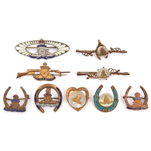 439 - 9 R Artillery sweetheart items, each featuring the cannon badge: 4 various enamelled horseshoe badge... 