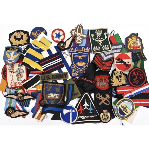 446 - A quantity of cloth badges, insignia, etc,  including British, American, foreign, short lengths of m... 