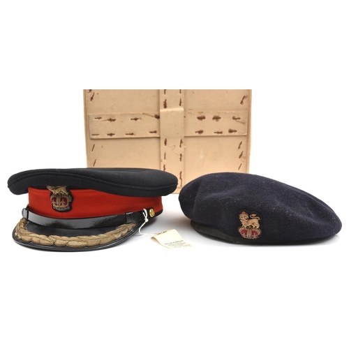 477 - An ERII General Officer’s blue peaked cap, gilt embroidered black PL peak, PL chinstrap, scarlet hea... 