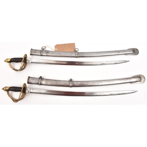 504 - 2 Indian cadet swords, each with slightly curved, fullered blade 22½”, marked “India” at forte, Fren... 