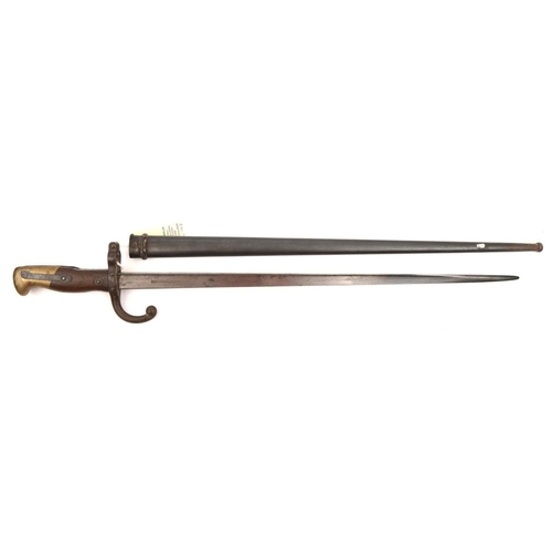 579 - A French   M1874 Gras bayonet, d 1876 on backstrap, in scabbard, with matching nos 34506. GC, a good... 