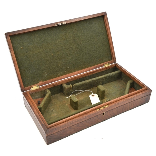 600 - A green baize lined oak case fitted to take a pair of 16” duelling pistols,  the depth increased by ... 