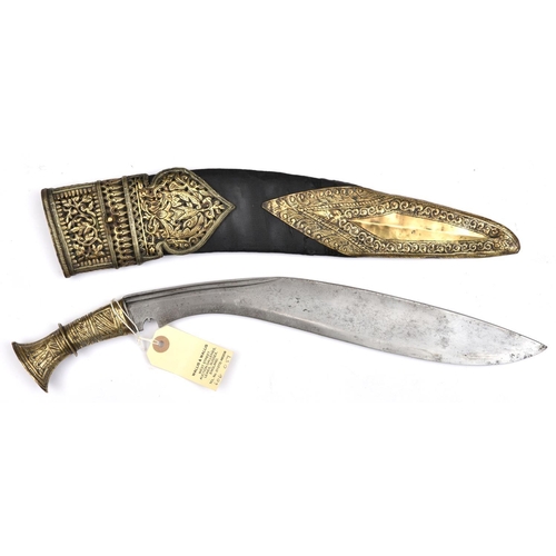 609 - A kukri, blade 14”, with short twin back fuller, sheet brass covered hilt embossed with stylized fol... 