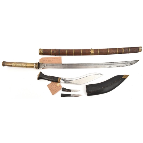 618 - A Burmese shortsword dha, slightly curved, swollen blade 21”, with shallow back fuller, sheet brass ... 